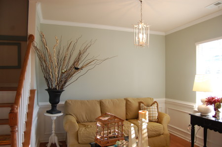 white-paint-wall-decors-brown-leather-sofa-unique-chandelier-light-ceiling-black-wooden-end-table-for-living-room-by-the-way-the-color-i-used-favorite-bedroom-paint-colors-interior-liv